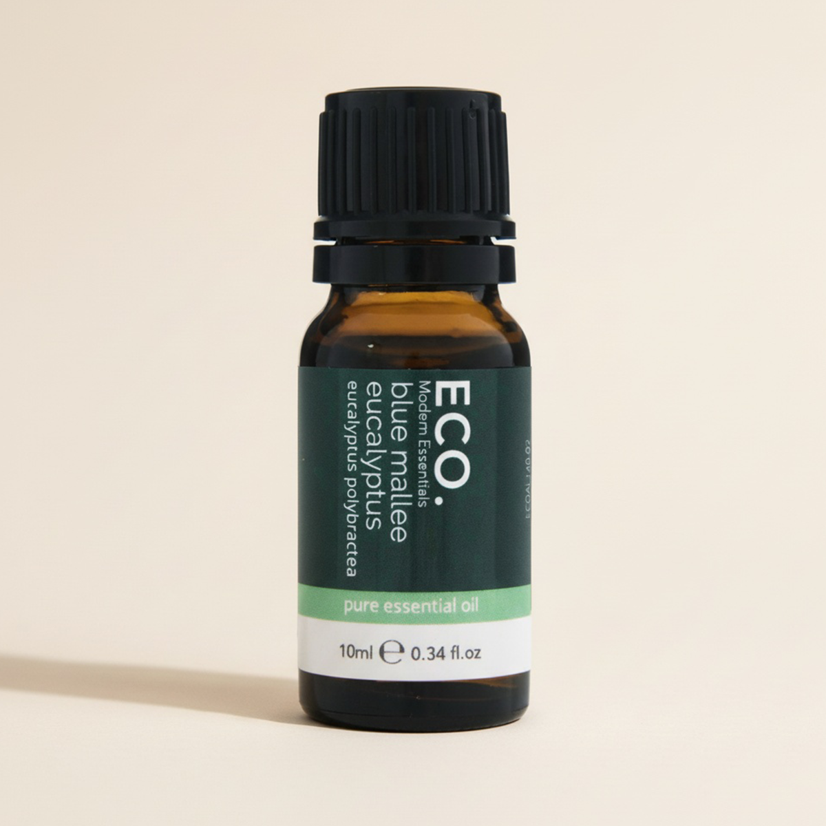Bottle of ECO essential oil on a beige background