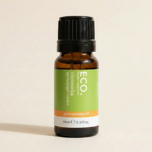 Bottle of ECO citronella pure essential oil on a beige background