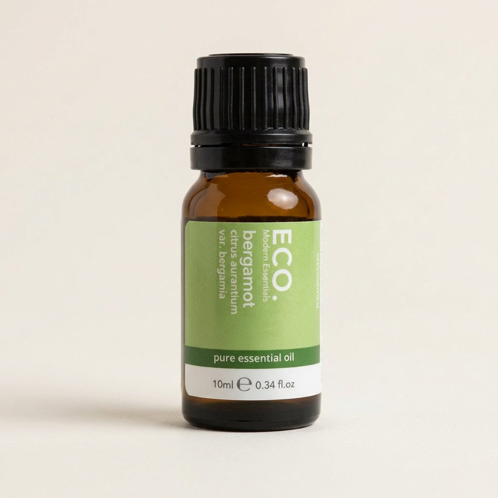 Bottle of ECO bergamot pure essential oil on a beige background