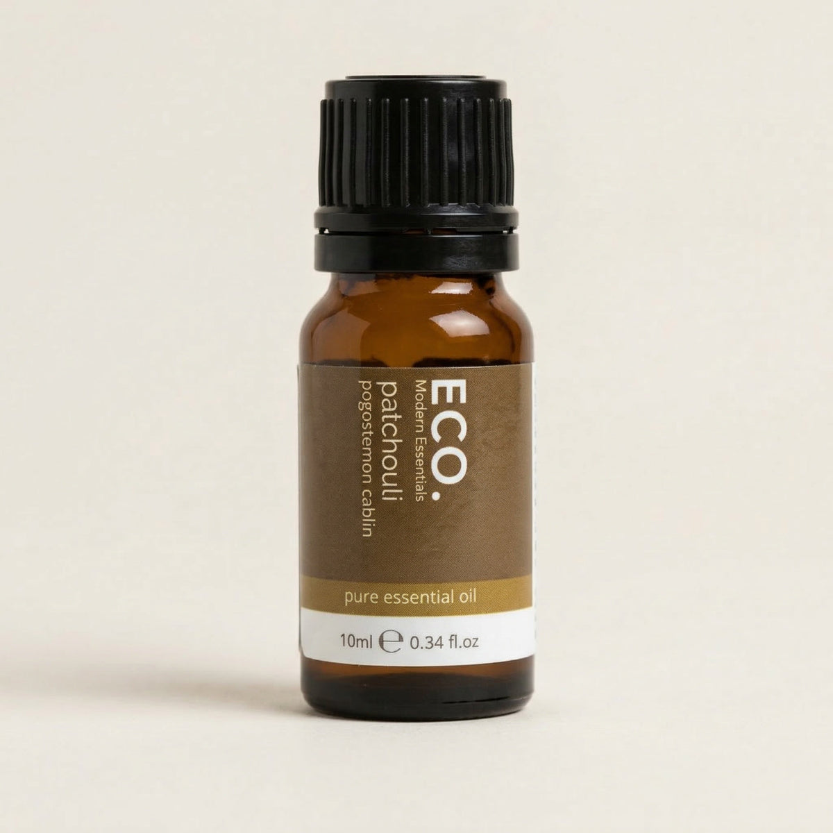 Bottle of Eco Patchouli pure essential oil on a beige background