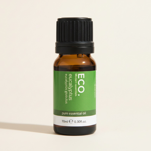 Bottle of ECO pure essential oil on a beige background