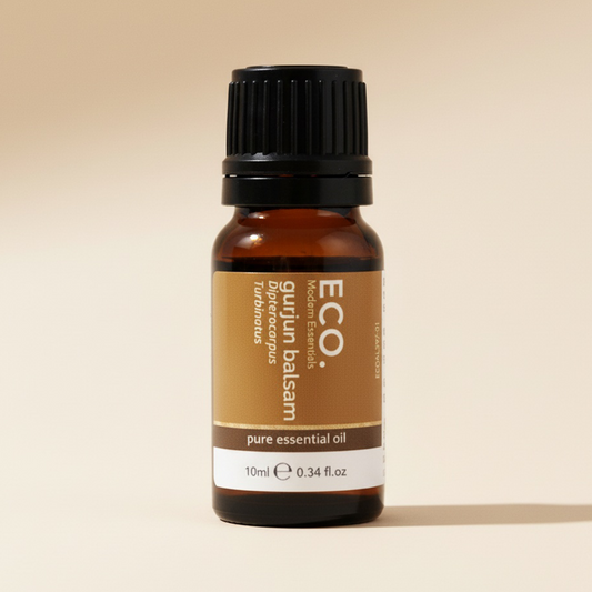 Bottle of ECO pure essential oil on a beige background