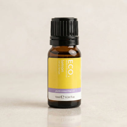 Bottle of ECO lemon pure essential oil on a beige background
