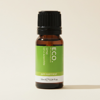 Bottle of ECO lime pure essential oil on a beige background