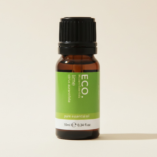 Bottle of ECO lime pure essential oil on a beige background
