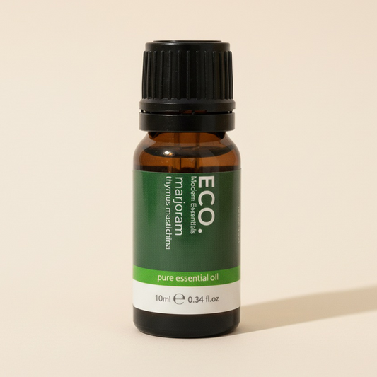 Bottle of ECO marjoram pure essential oil on a beige background