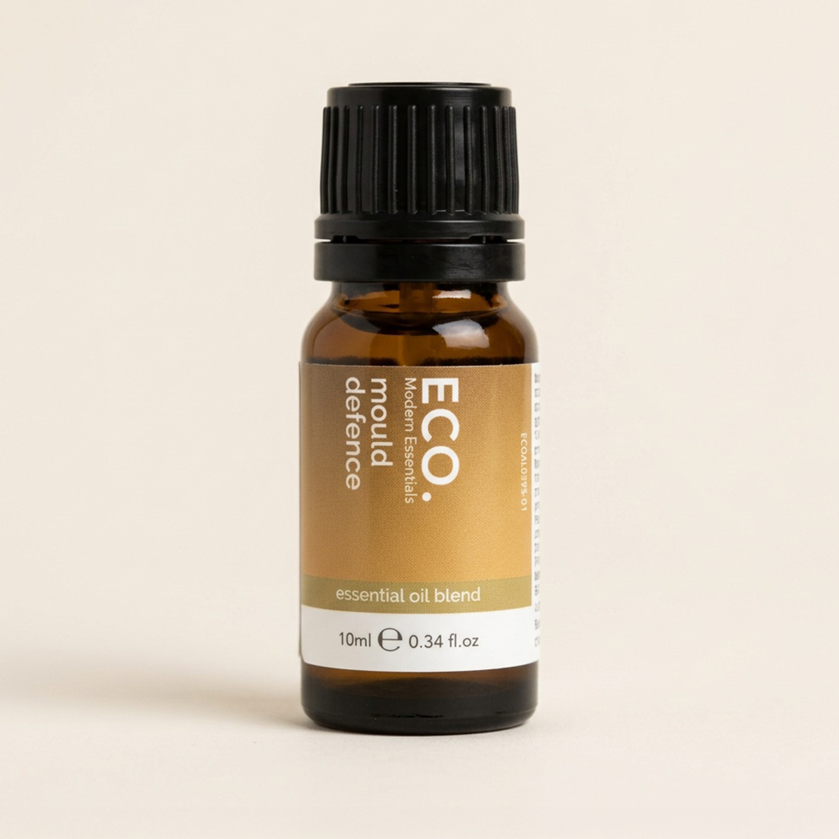 Bottle of ECO. defence mould essential oil blend on a beige background