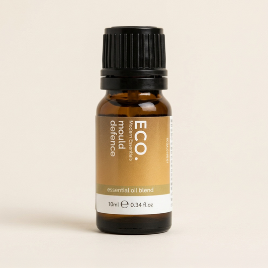 Bottle of ECO. defence mould essential oil blend on a beige background