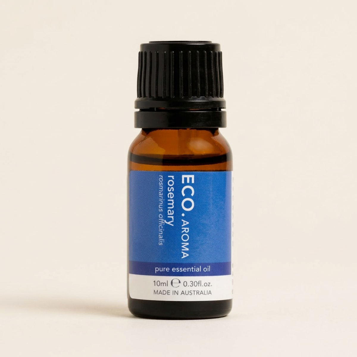 Bottle of ECO Aroma rosemary pure essential oil on a beige background