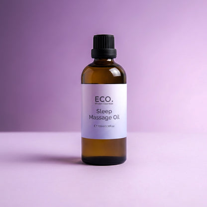 Bottle of ECO Sleep Massage Oil on a purple background