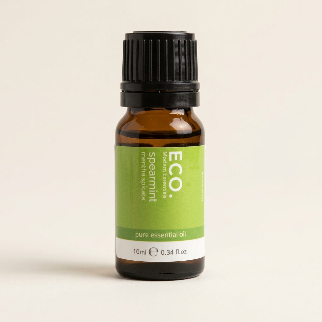 Bottle of ECO spearmint pure essential oil on a beige background