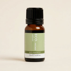 Bottle of ECO Aroma vetiver pure essential oil on a beige background