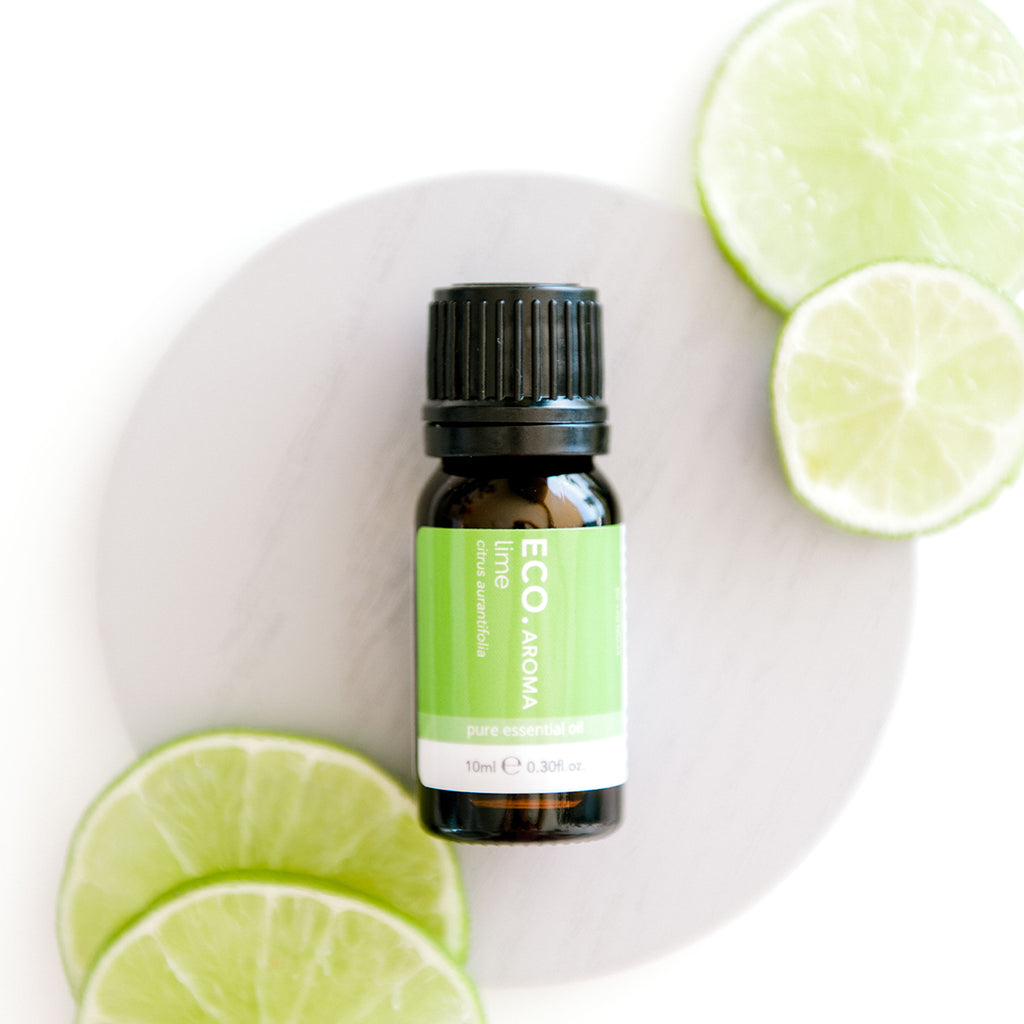 lime essential oil and cut limes 